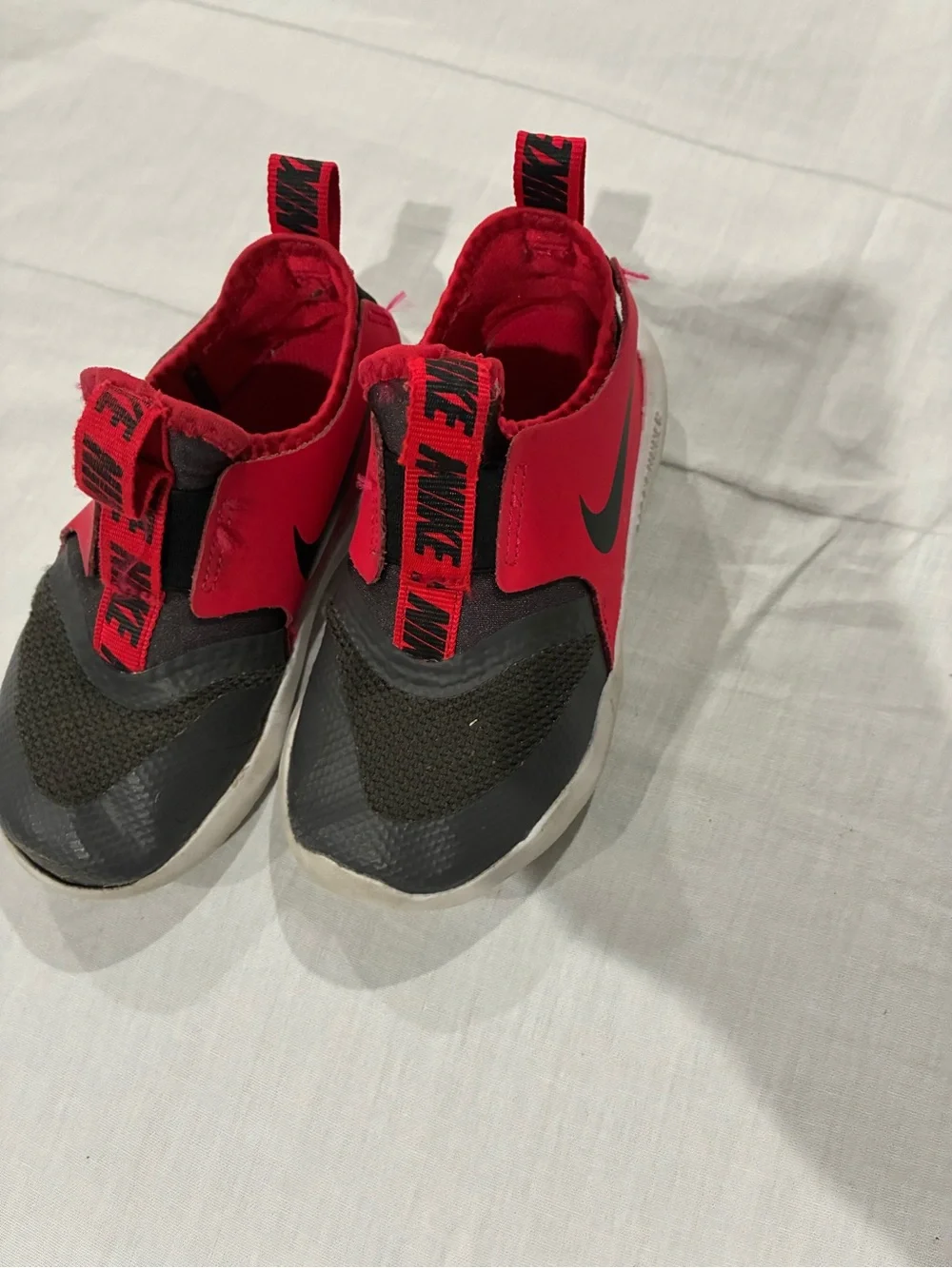 Nike Kids Slip-On Sneakers in Red and Black